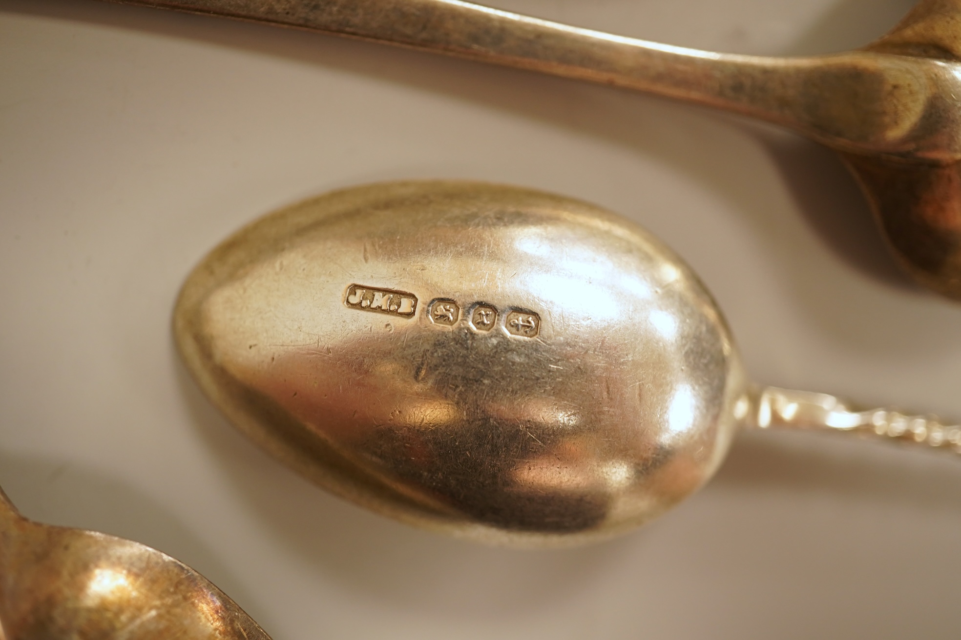 A small quantity of 18th century and later assorted silver teaspoons, various patterns, dates and makers, together with a George V silver pastry fork and two George V silver caddy spoons, 10.7oz.